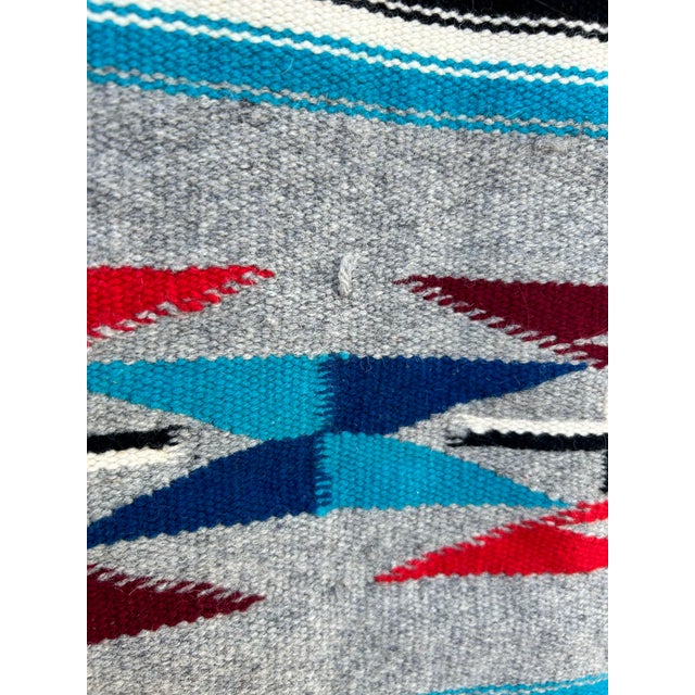 A very nice small striped tribal rug or wall hanging, most likely from Central America. We do not know the age. We...