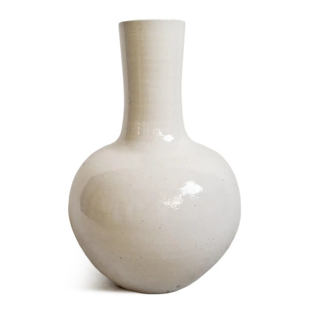 Vintage elegant modern white long neck ceramic vase. Opening at top is 5" diameter. Each is sold individually. Each may...