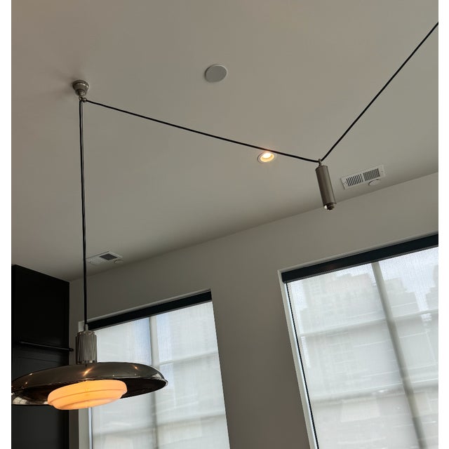 Brand new Romann and William Oscar Counterweight drop light in French Silver—beautiful and unique fixture for any space....