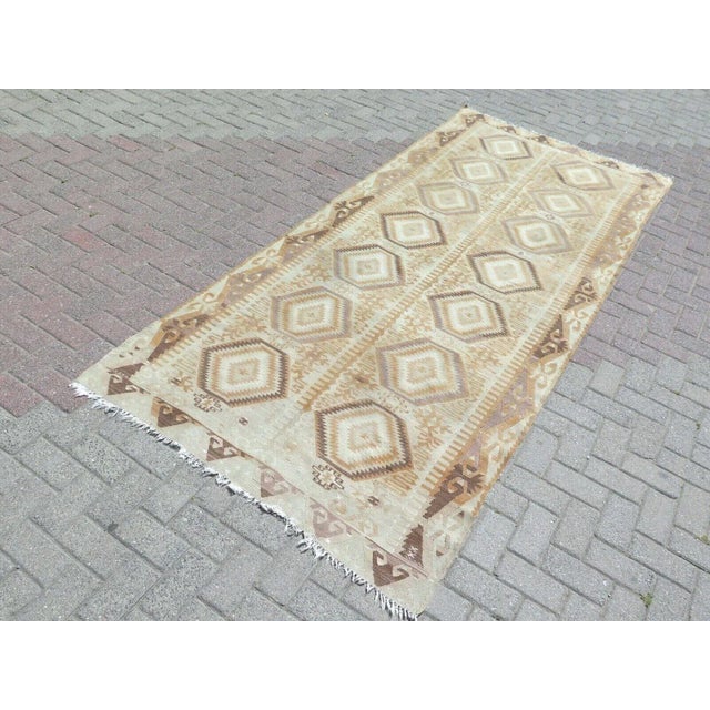 This beautiful, traditional vintage, flatweaved Turkish runner is approximately 60 years old. It is handmade of very fine...