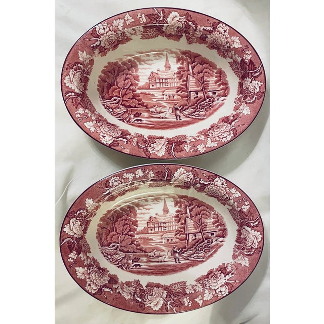 This listing is for a lovely pair of oval vegetable dishes with red transferware decoration depicting a shepherd with...