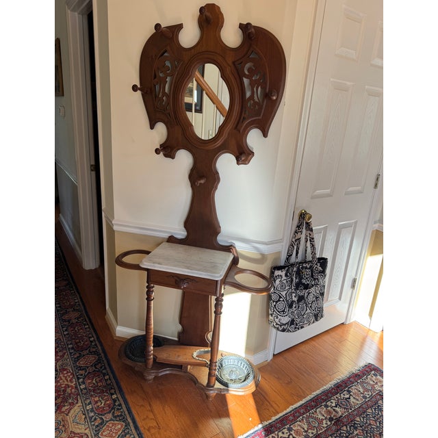 Antique hall tree w umbrella stands, mirror and small drawer. Great condition. Approx 74” tall x 32” wide. Pickup in...