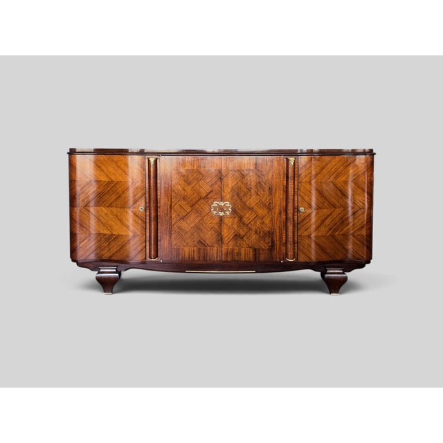 This elegant Italian four-door cabinet, produced in the late 1940s, reflects the transition between the refined geometry...