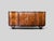 This elegant Italian four-door cabinet, produced in the late 1940s, reflects the transition between the refined geometry...