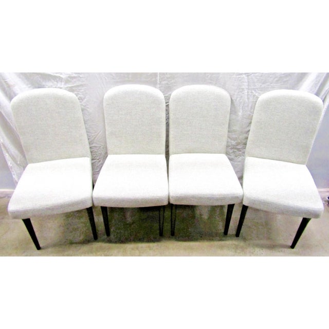 The New Universal Nina Magon Yves Dining Side Chair (Set of 4) 941A738 is a modern and stylish dining chair designed for...