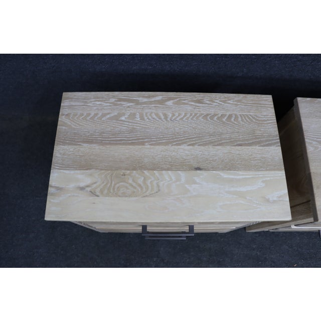 Pair of contemporary solid white oak nightstands by Vaughan-Bassett in a bleached white oak finish. Each features two...