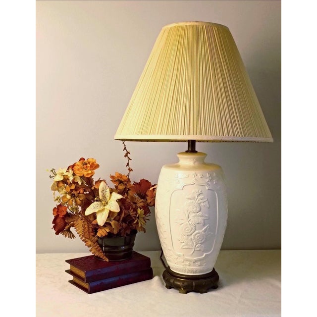This blanc de chine table lamp introduces an authentic East Asian aesthetic to an intentional, elevated interior space....