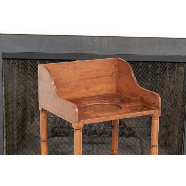 Antique English wash stand base with hand-cut dovetail joints, tapered legs, lower shelf and drawer. Product Information:...