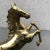 This large solid brass horse combines elegance and craftsmanship excellence. The statue impresses with its dynamic shape...