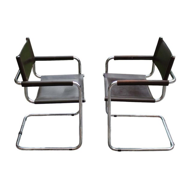 A beautiful set of 2 armchairs in brown leather