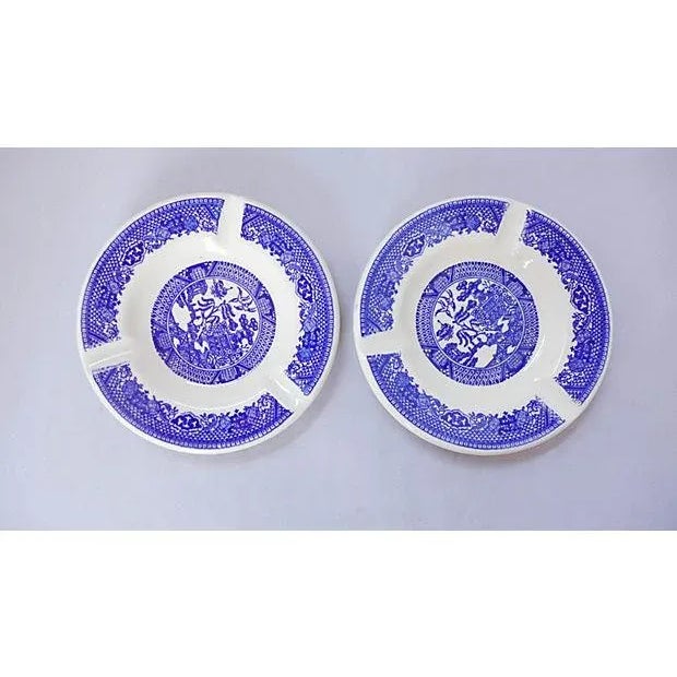 Set of two Midcentury Asian Motif Blue and White Ashtrays. They are in excellent condition. 5.5" W x 0.85" H