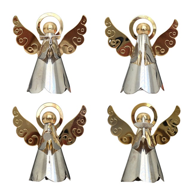 Extraordinary set of silver and gold plated brass angels. Set of 4 includes an angel with a caroling book, an angel with...