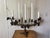 Gorgeous, iron French candelabra depicting grapes, wheat, vine leaves and lilies! This intricate antique piece likely came...