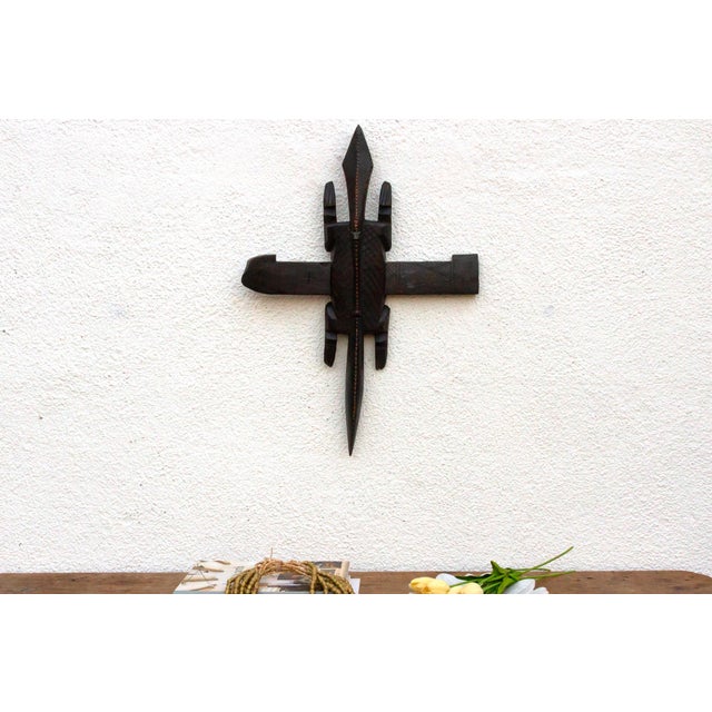 This antique Bambara door lock, crafted in the form of a lizard, is a testament to the ingenuity and artistry of the...