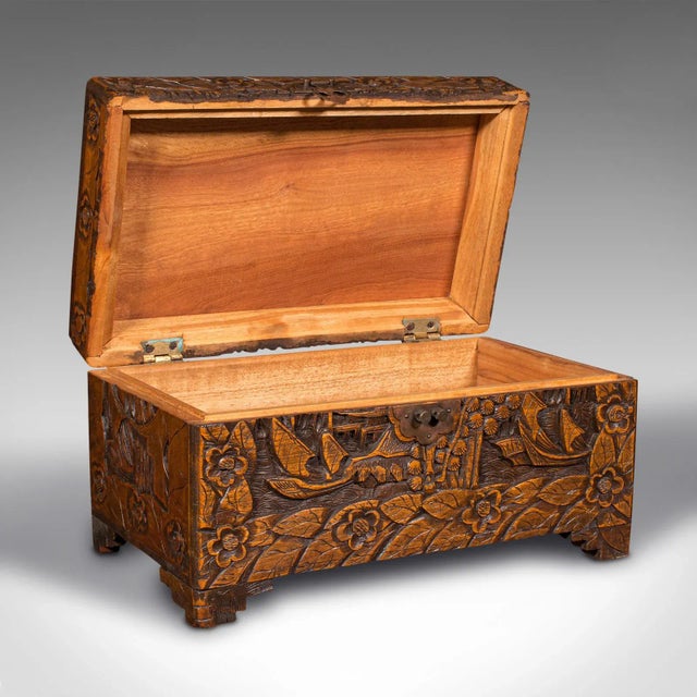This is a small antique apprentice chest. An English, camphorwood sample storage box, dating to the early 20th century,...