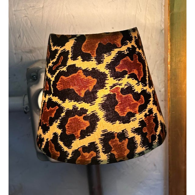 A plug in nightlight handmade with leopard print fabric, bulb included