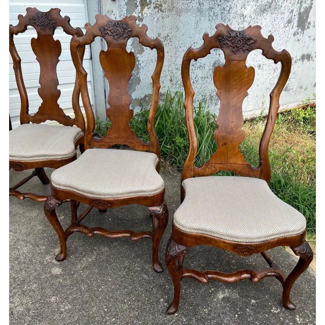Very fine set of 10 18th century Italian carved walnut dining chairs from the late baroque- early rococo period. Recently...