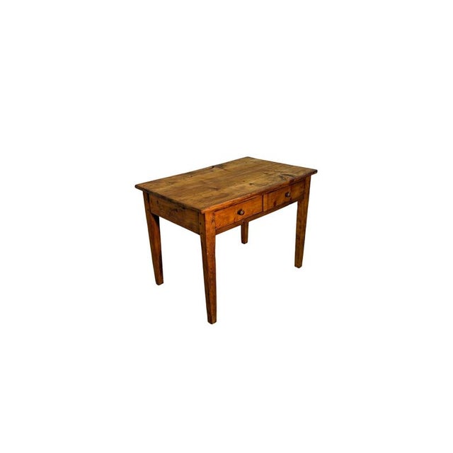 A rustic table dating back to the early decades of the twentieth century, crafted from fir wood and characterized by a...