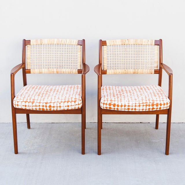 A fabulous pair of 1950s solid walnut armchairs, designed by Sylve Stenquist for Dux of Sweden. The arms feature a flat...