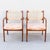 A fabulous pair of 1950s solid walnut armchairs, designed by Sylve Stenquist for Dux of Sweden. The arms feature a flat...