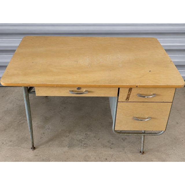 **Description:** Vintage 1950s industrial writing desk attributed to Raymond Loewy for Brunswick. The desk features a...