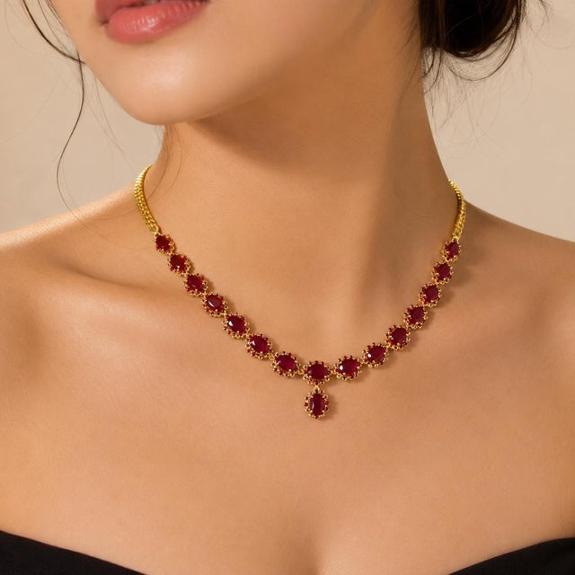 Add a touch of regal elegance to your collection with this 22K Yellow Gold Necklace with Natural Rubies. This...