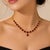 Add a touch of regal elegance to your collection with this 22K Yellow Gold Necklace with Natural Rubies. This...