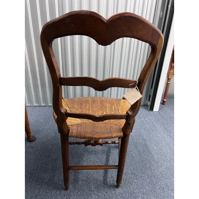 The chair is Louis XV French Provincial. The rush seat base panel is still in very good condition and the carved upper...