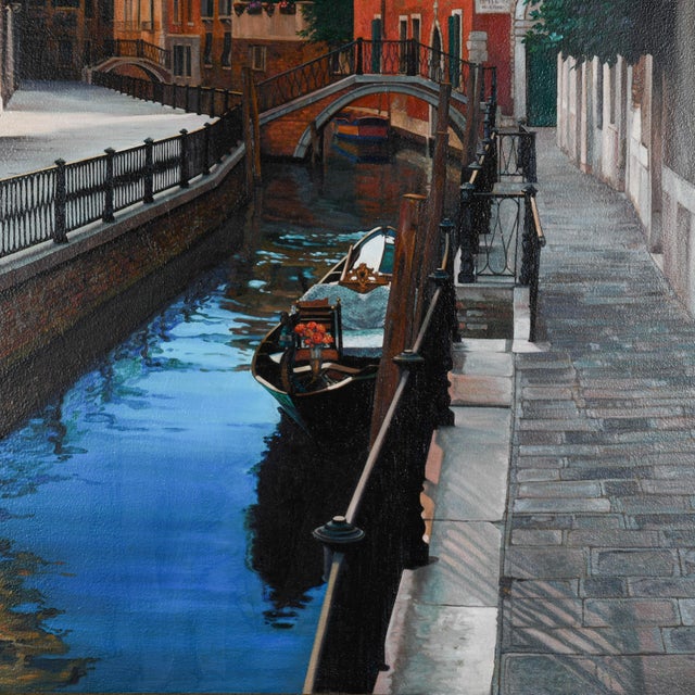 An Italian Oil Painting on Canvas Depicting the Canal of Venice captures the serene beauty of the iconic waterway, with...
