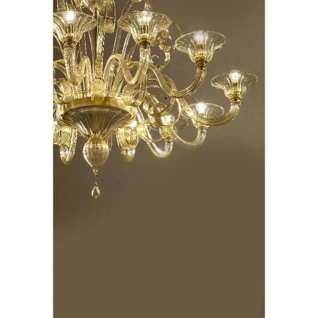Elegant scenographic chandelier in champagne color made in Murano glass and gold24 k plated metal frame. For classical and...
