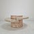 Elegant round coffee or side table from the 1980s, crafted from polished Mactan stone, also known as fossil stone. The...