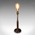 This is a vintage table lamp base. An English, nickel brass decorative accent light, dating to the late 20th century,...