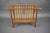 This elegant vintage magazine rack was made in Czechoslovakia during the 1950s. Its open-frame construction combines...
