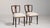 Executed in the refined tradition of the Empire style, this distinguished pair of English accent chairs from the 19th...