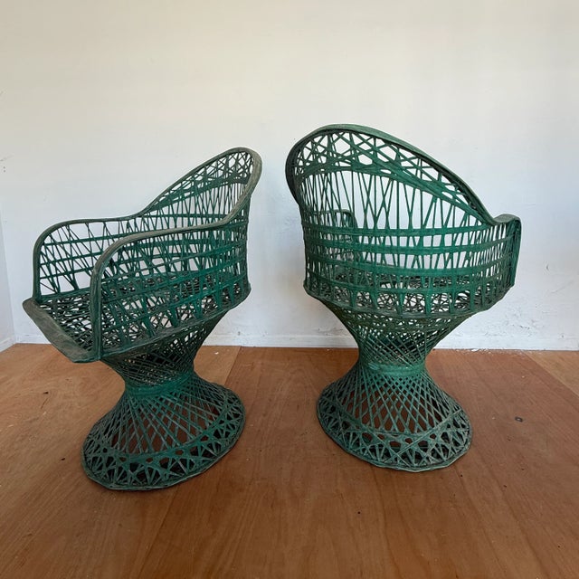 A pair of Woodard spun fibreglass chairs, Designed by Russell Woodard, one of the third generation members or Woodard...