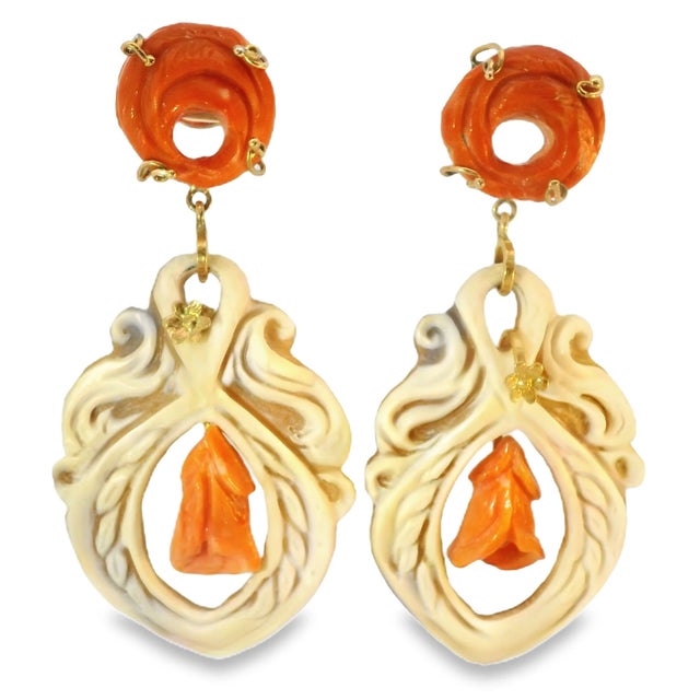 Stunning estate 18K gold drop earrings featuring carved shell and vibrant undyed red coral for a bold, elegant statement....