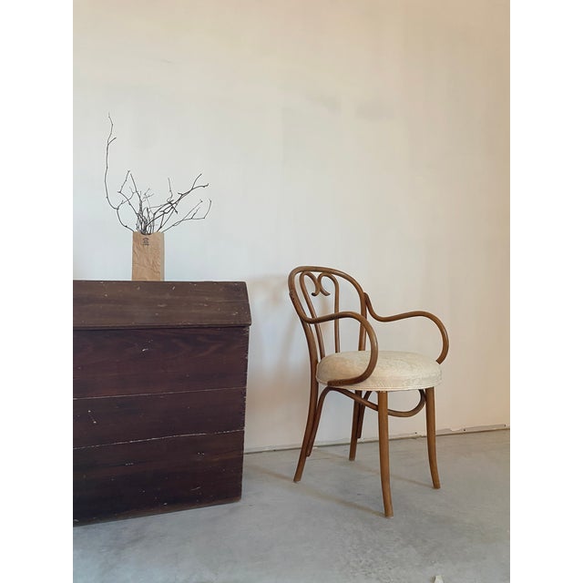 Bentwood Thonet armchair; reupholstered in the 1980s, but original cane seat remains and appears to be in great condition...