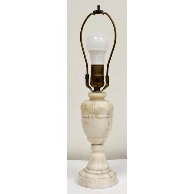 Elegant antique Italian alabaster urn motif lamp featuring classical carved details. Lamp base measures 4"dia, rising to...