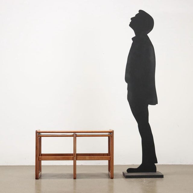 Teak veneered wood centre table. This piece is attributed to the mentioned designer/maker. It has no attribution mark and...