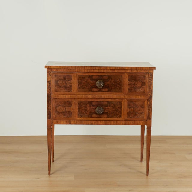 Impressive 18th century Italian two drawer chest handcrafted in walnut with dramatic burled walnut panels inside cross...