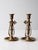 This is a pair of antique brass chambersticks. The candlestick holders tilt for safety and can be positioned and tightened...