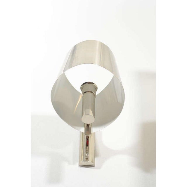 Designer: Jacques Charles Dims.: 11"W x 13"D x 16"H Finish: Polished Chrome Beautiful pair of sculptural sconces from the...