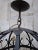 A striking Dutch wrought-iron chandelier from the early 20th century, strongly reminiscent of the Amsterdam School and...