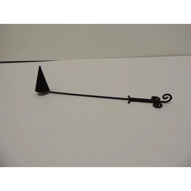 Black metal candle snuffer With rounded or vine Shape hand and cone shape Arts & Craft Style Size: 11.5"L x 1.25"D x 2.5"W.