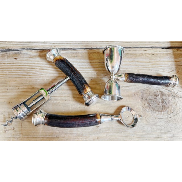 A beautiful circa 1930s three piece John Hasselbring barware set in case; this set includes a corkscrew, jigger and bottle...