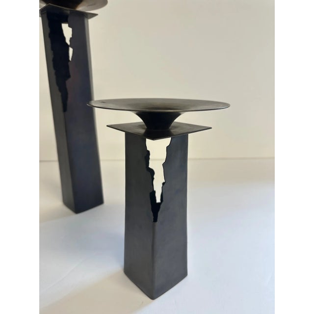 Eye catching hand made set of 3 graduated pierced copper and brass candlesticks having makers mark on bottom. Largest 15 h...