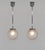 Simonet frères & Dieupart A pair of French Art Deco pendant lights, circa 1925–1935. The fixtures in nickel-plated solid...