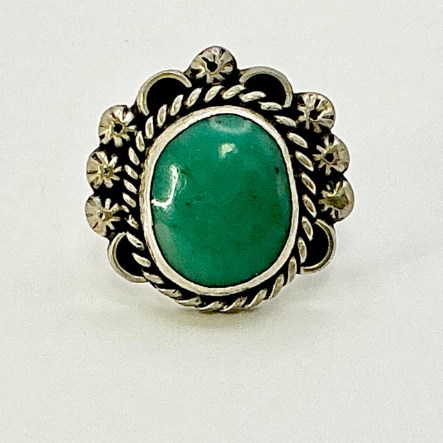 Vintage Home is pleased to present this gorgeous sterling silver cocktail ring with a Turquoise stone and sterling rope...