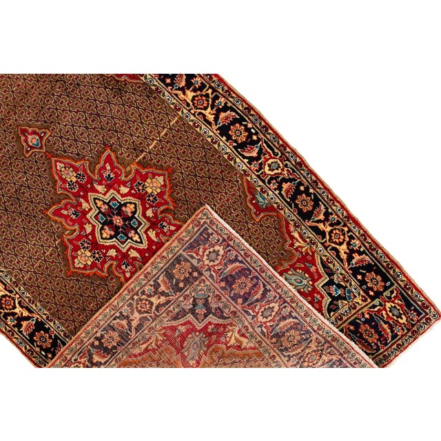 Beautiful vintage Persian hand-knotted wool rug with a brown field. This piece has a multi-color accent in an all-over...