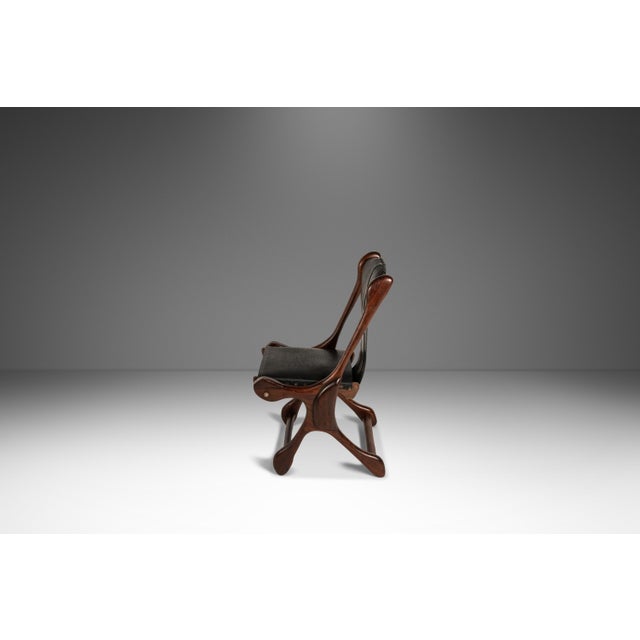 Introducing a rare set of two mid-century modern leather "sloucher" sling chairs designed by Don Shoemaker in solid...